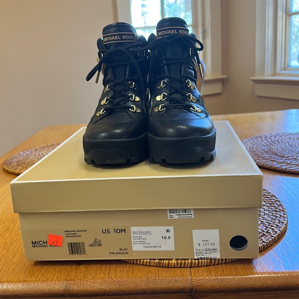 Michael Kors leather black boots with gold details excellent condition.